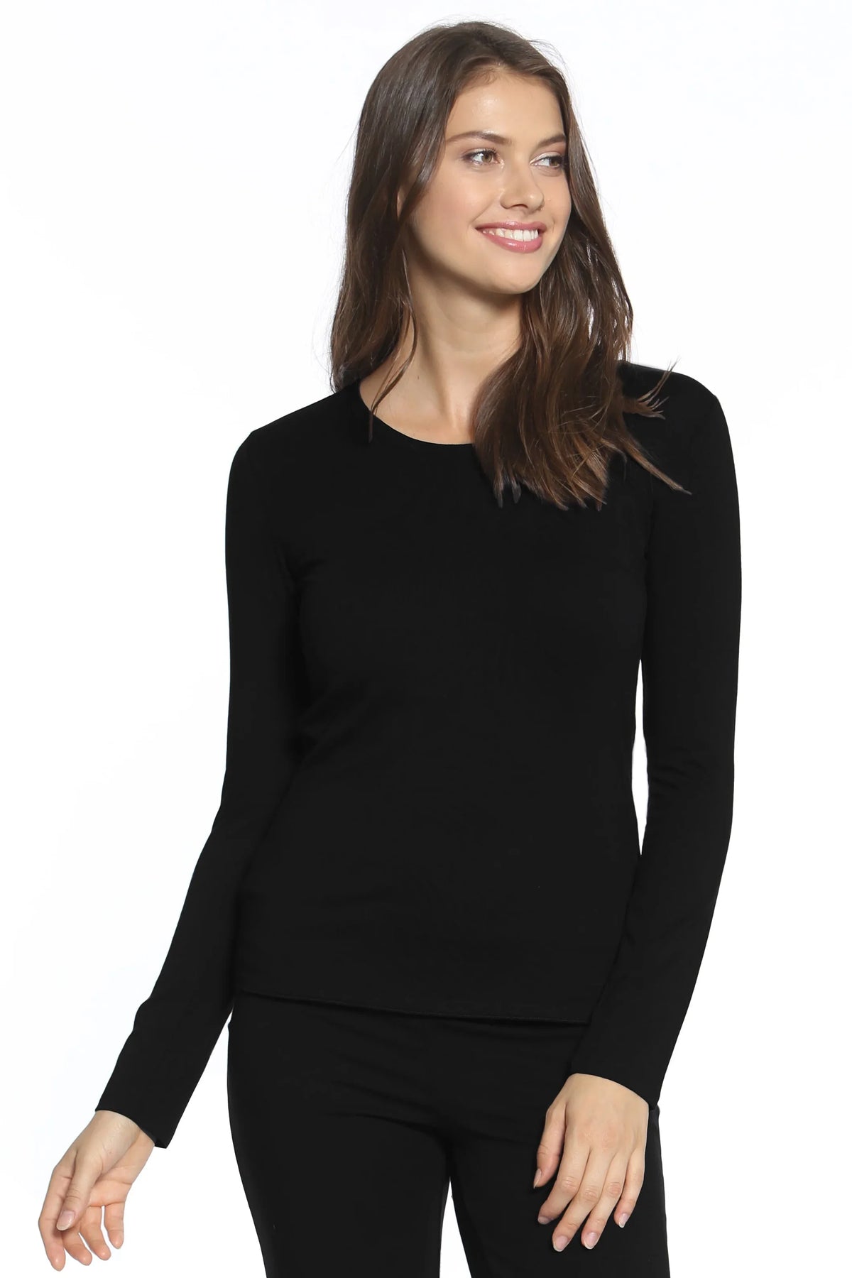 Woman wearing black long sleeve Pima cotton loungewear top and bottoms