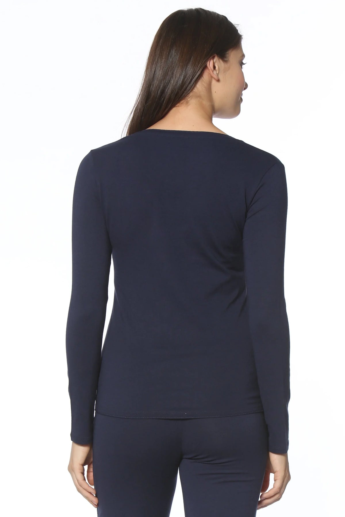 Woman wearing navy long sleeve loungewear top and pants set, back view