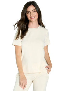 Woman wearing almond beige Pima cotton short sleeve loungewear top and pants set