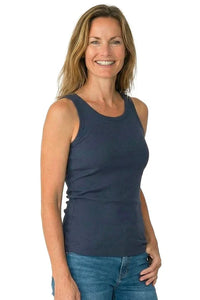 Woman wearing a steel blue ribbed tank top and blue jeans, casual sleepwear style