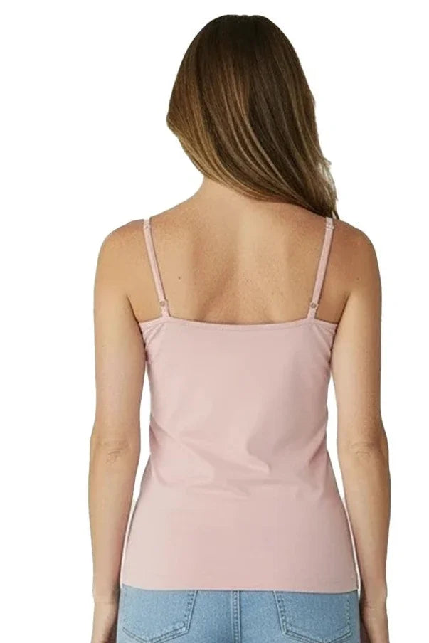 Woman wearing light pink camisole top with adjustable straps and blue jeans, back view