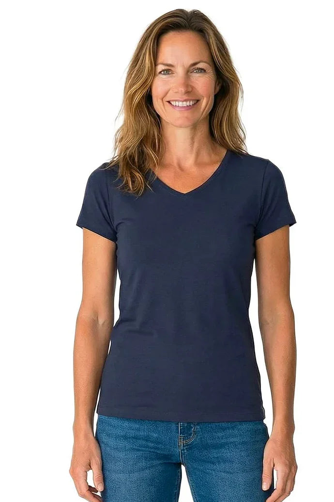Woman in a navy blue V-neck short sleeve Pima cotton tee and blue jeans, front view