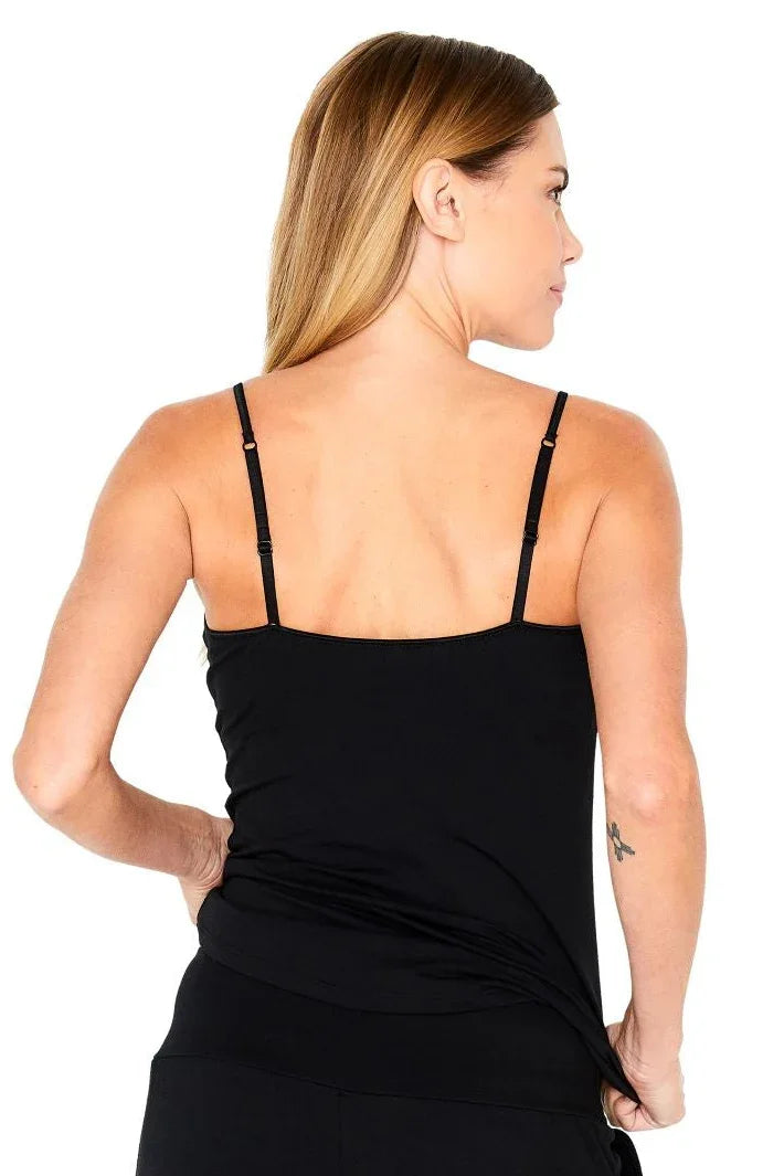 Back view of woman wearing black loungewear camisole with adjustable straps
