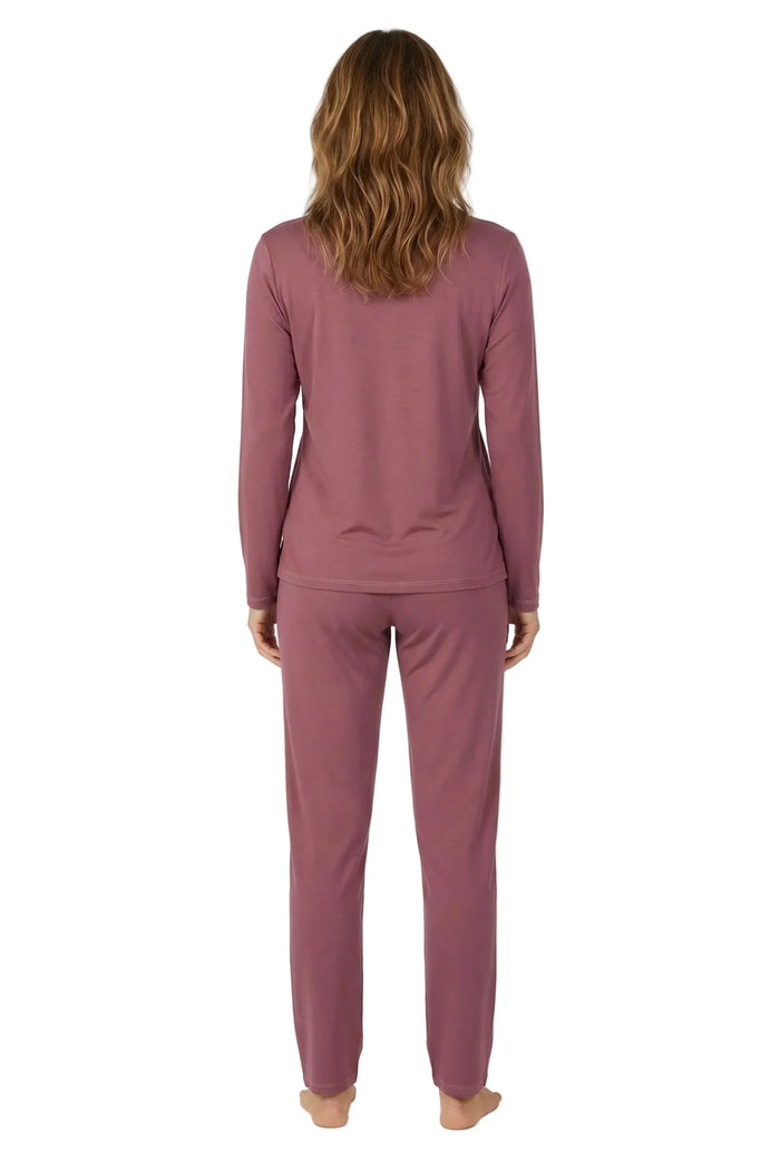 Woman wearing rosewood pink long-sleeve loungewear pajama set, viewed from back