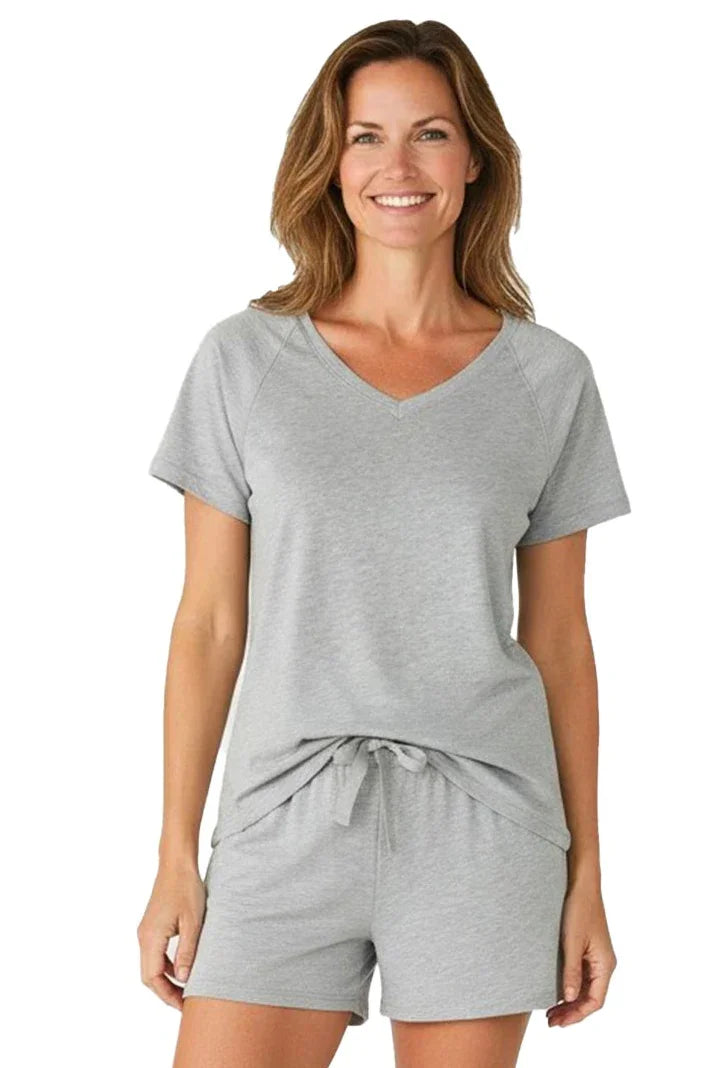 Woman wearing heather gray short sleeve loungewear sleepwear set with v-neck and drawstring shorts