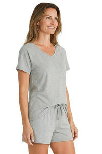 Woman wearing heather gray Pima cotton short sleeve loungewear set with drawstring shorts