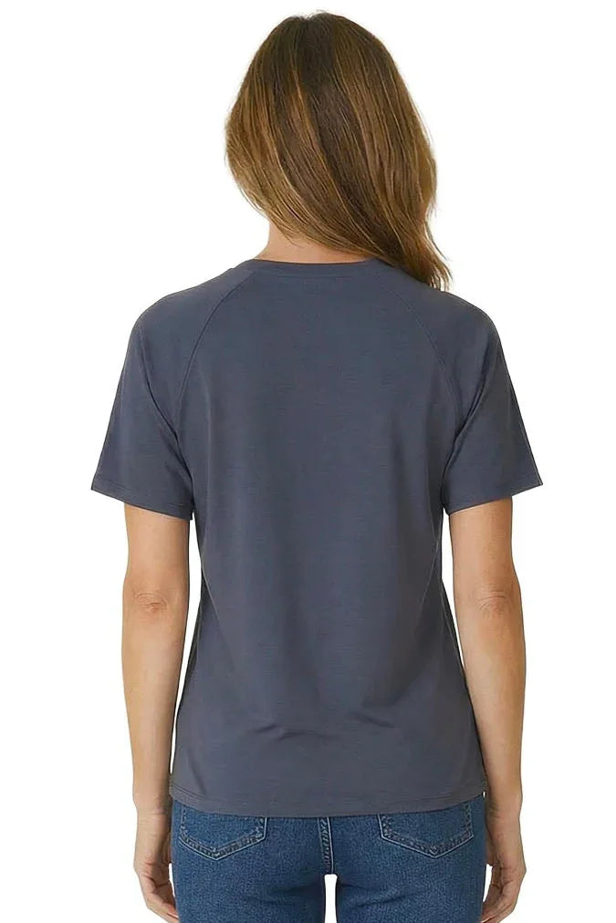 Woman wearing a steel blue short sleeve loungewear tee and blue jeans, back view