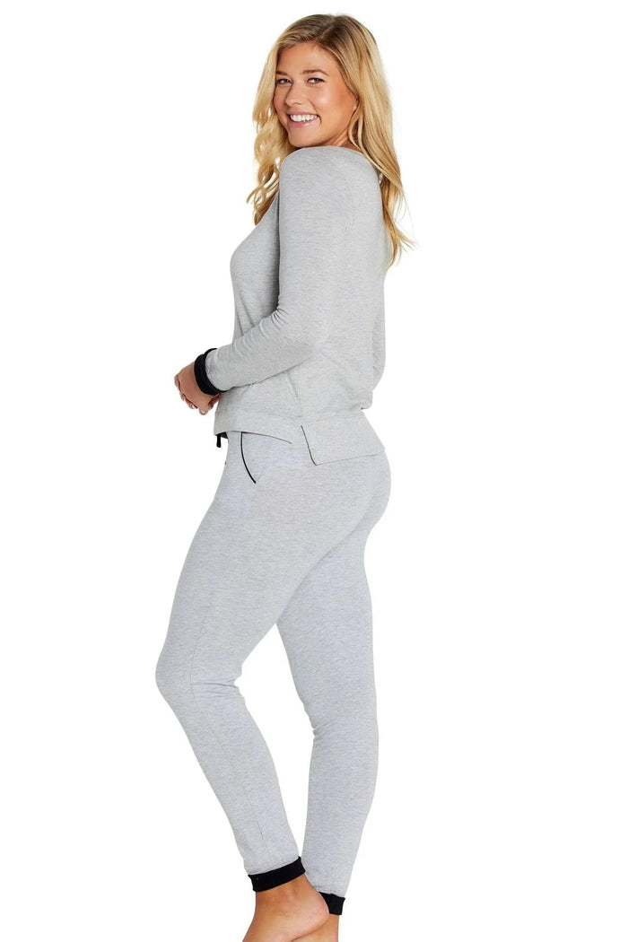 Woman wearing heather gray Pima cotton loungewear set with long sleeves and jogger pants