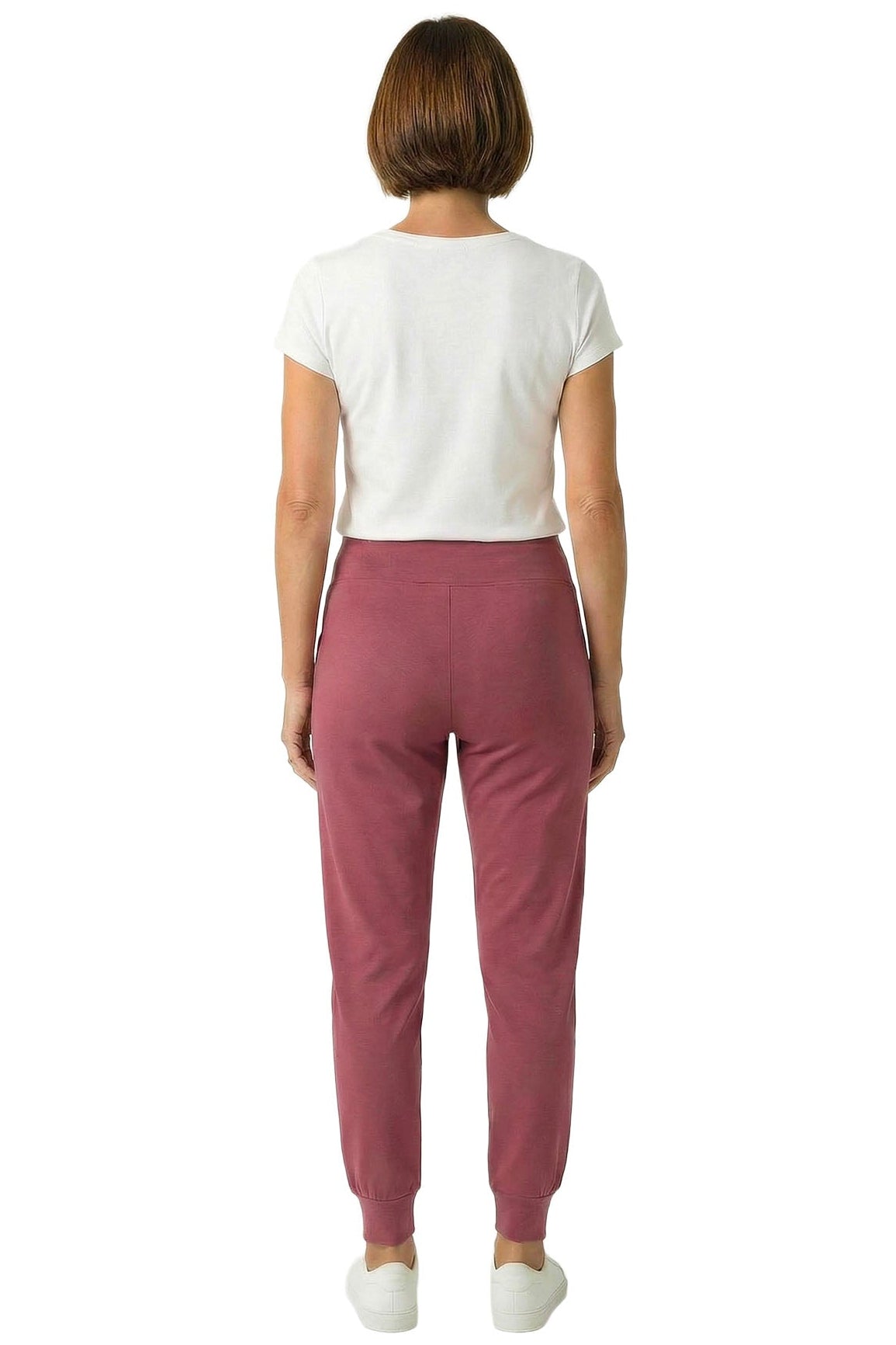 Woman wearing rosewood jogger lounge pants and white tee, shown from the back