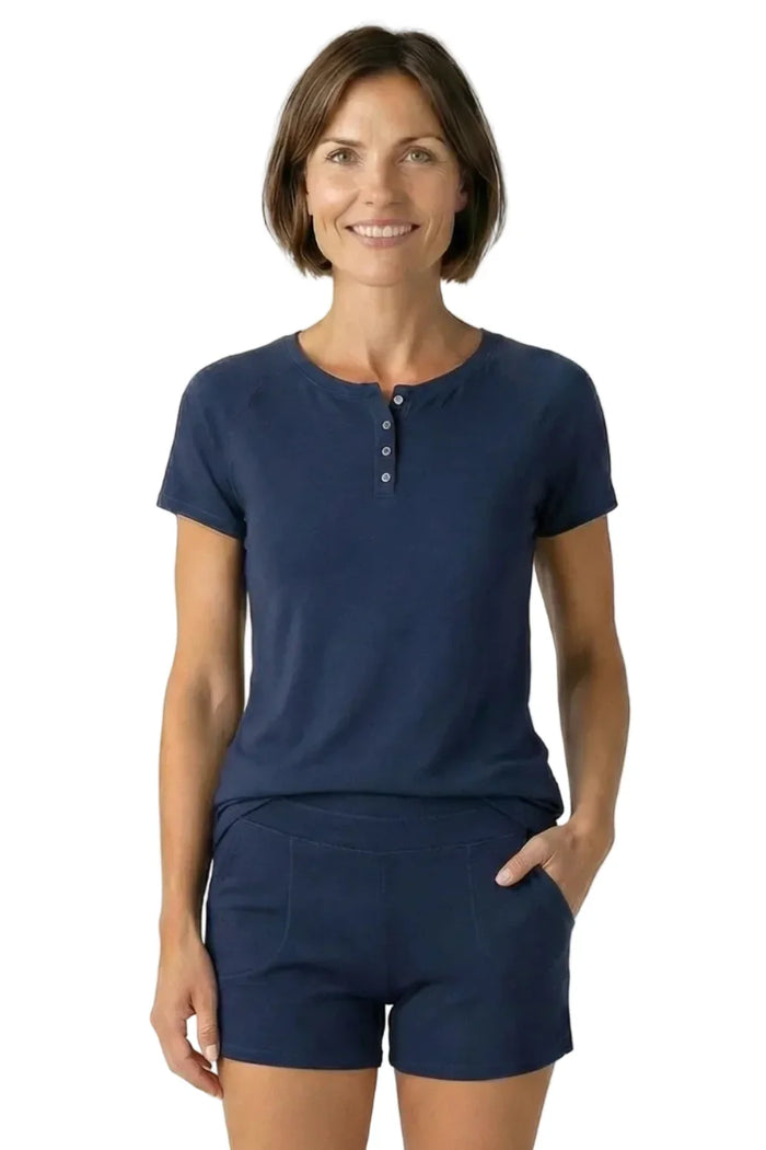 Woman wearing midnight blue short sleeve Pima cotton lounge set with button-front top