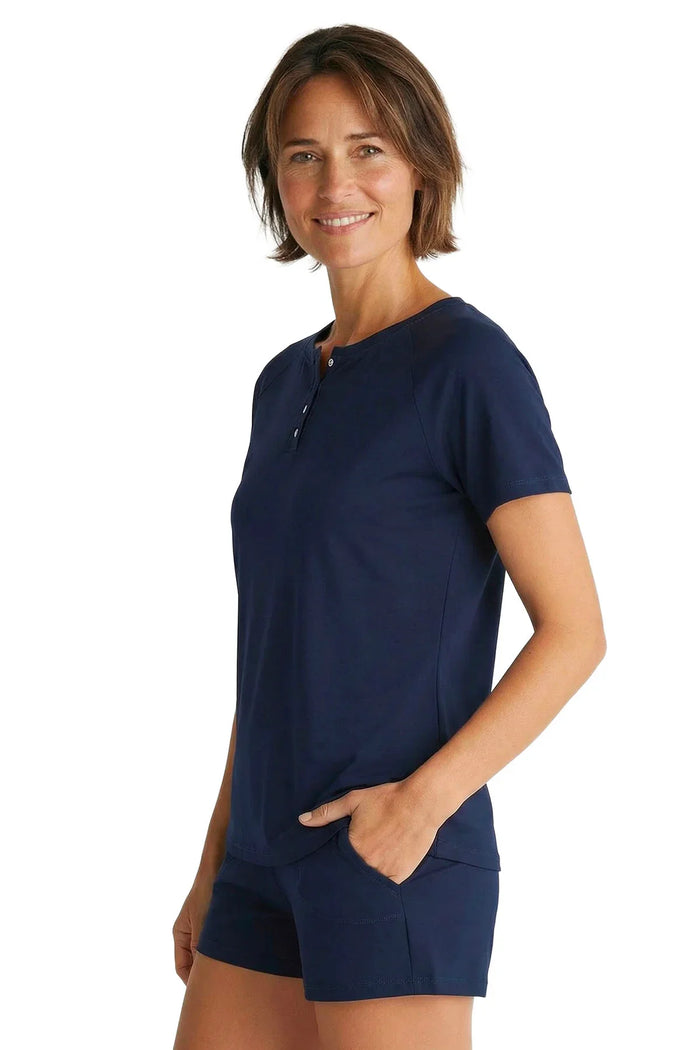 Woman wearing navy blue Pima cotton short sleeve lounge sleepwear set with buttons