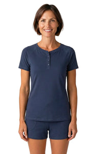 Woman wearing steel blue short sleeve henley top and matching loungewear shorts
