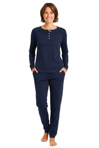 Woman wearing midnight blue long sleeve Pima cotton lounge set with jogger pants