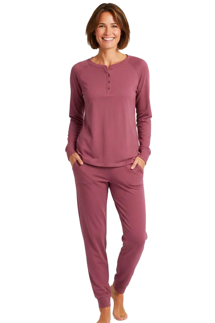 Woman wearing rosewood long sleeve Pima cotton loungewear set with jogger pants