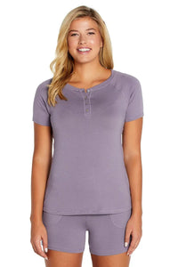 Woman wearing lavender Pima cotton loungewear sleep set with short sleeves and shorts