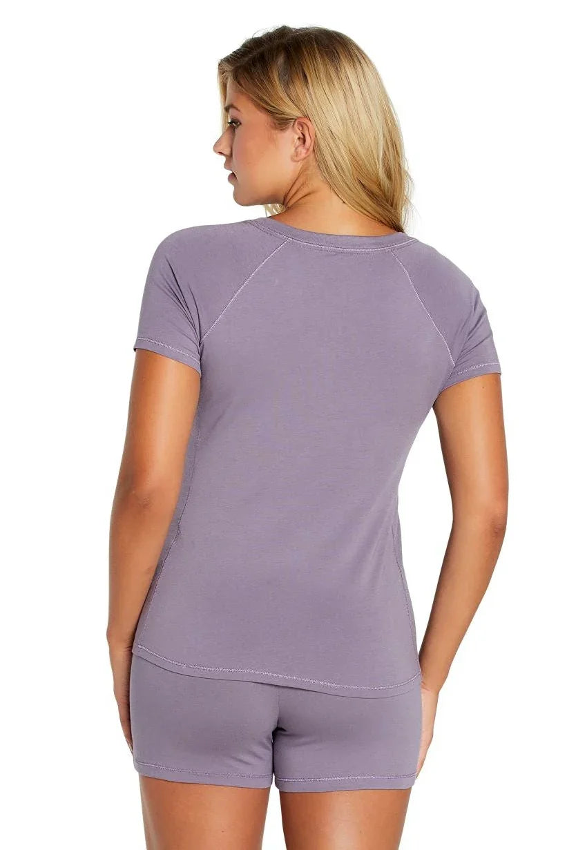 Woman wearing lavender Pima cotton loungewear sleepwear set, short sleeve top and shorts
