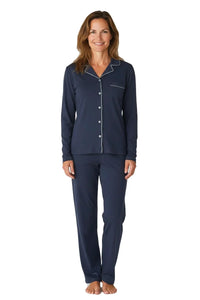 Woman wearing steel blue long-sleeve button-up pajamas with contrast piping on white background