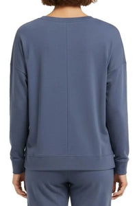 Back view of person wearing steel blue long-sleeve sweatshirt and matching pants