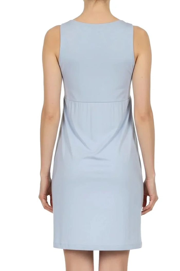 Back view of a woman wearing a sleeveless light blue knee-length dress