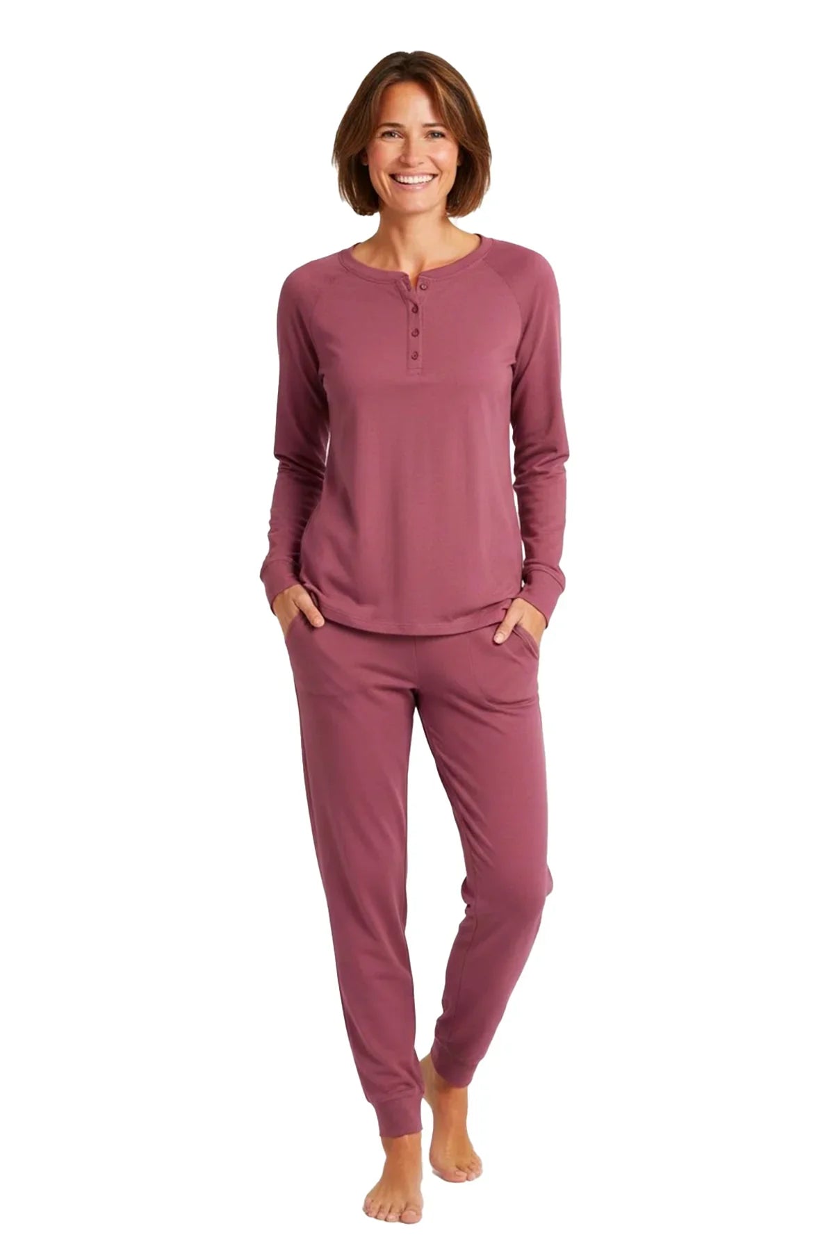 Woman wearing rosewood color long sleeve henley top and jogger pants loungewear set barefoot