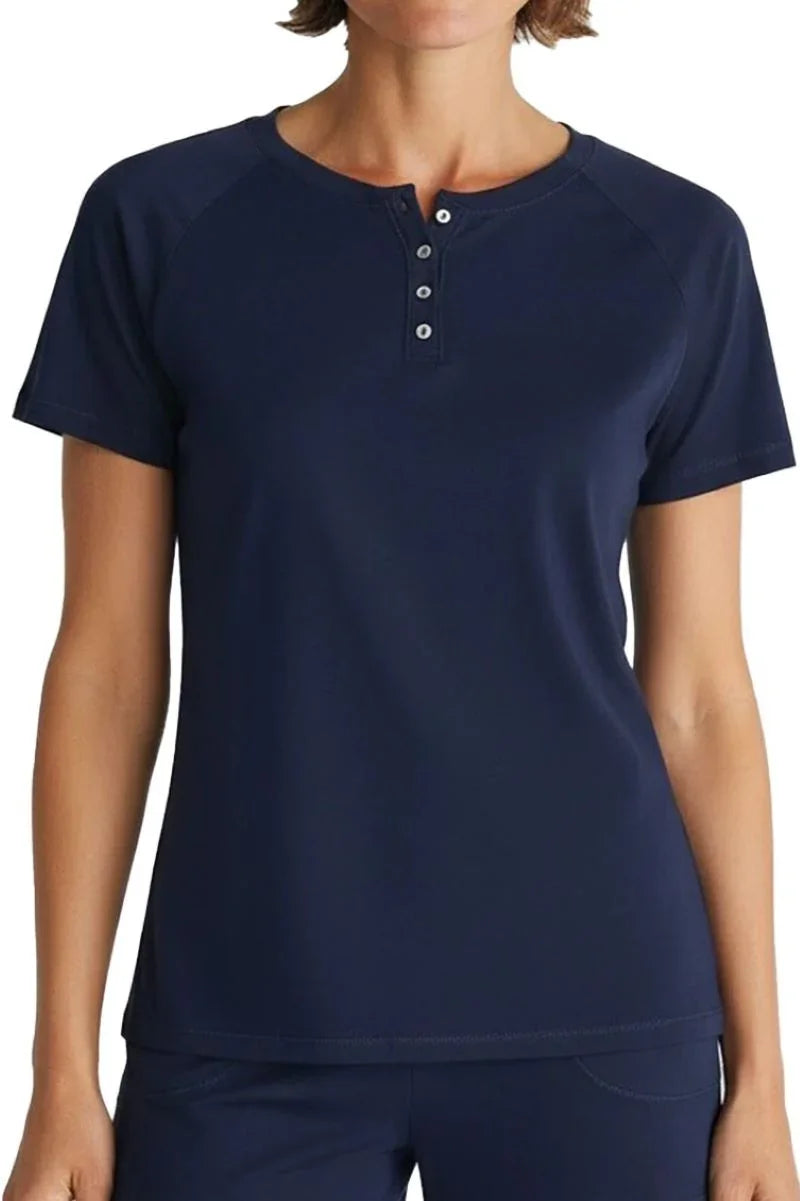 Woman wearing midnight blue short sleeve henley shirt with four buttons and round neckline