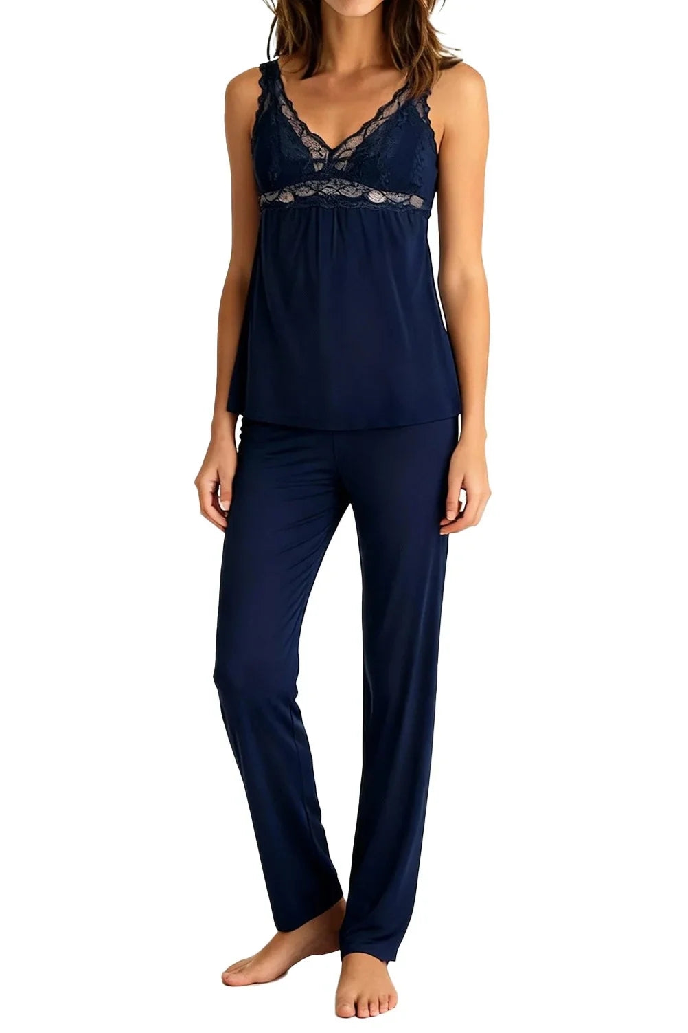 Woman wearing indigo navy blue lace-trim pajama set with sleeveless top and long pants