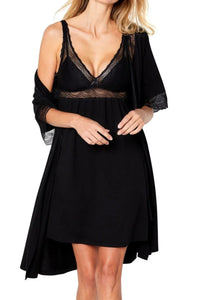 woman wearing black lace-trimmed nightdress with matching robe in white studio