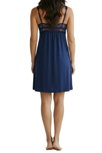 Back view of woman wearing navy blue lace-trimmed sleeveless nightdress with adjustable straps